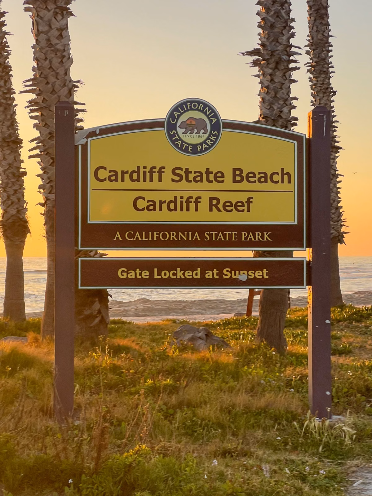 The Cardiff State Beach, Cardiff Reef entrance sign at sunset