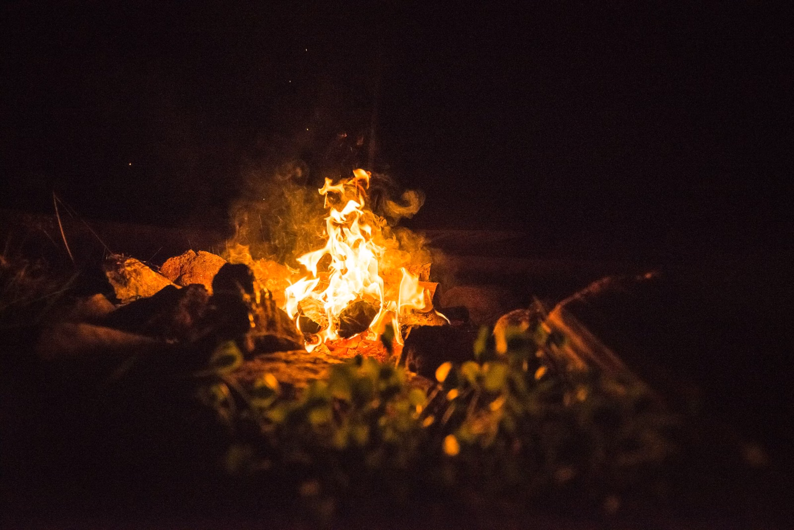 An evening campfire at a campsite